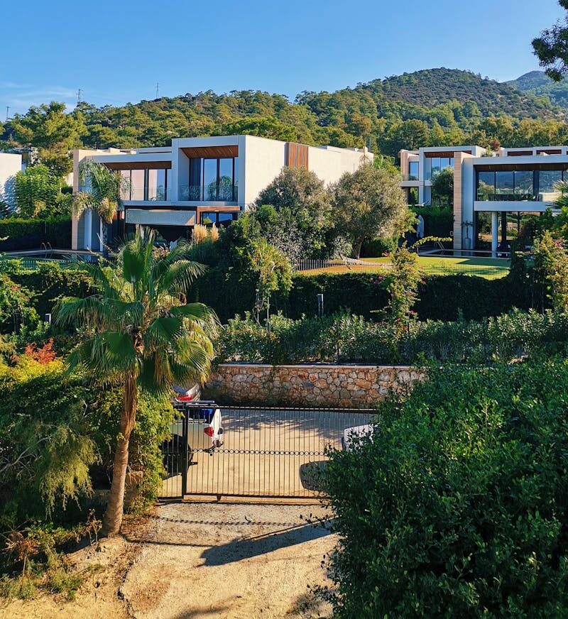 Beautiful modern villas surrounded by lush greenery in Muğla, Turkey.